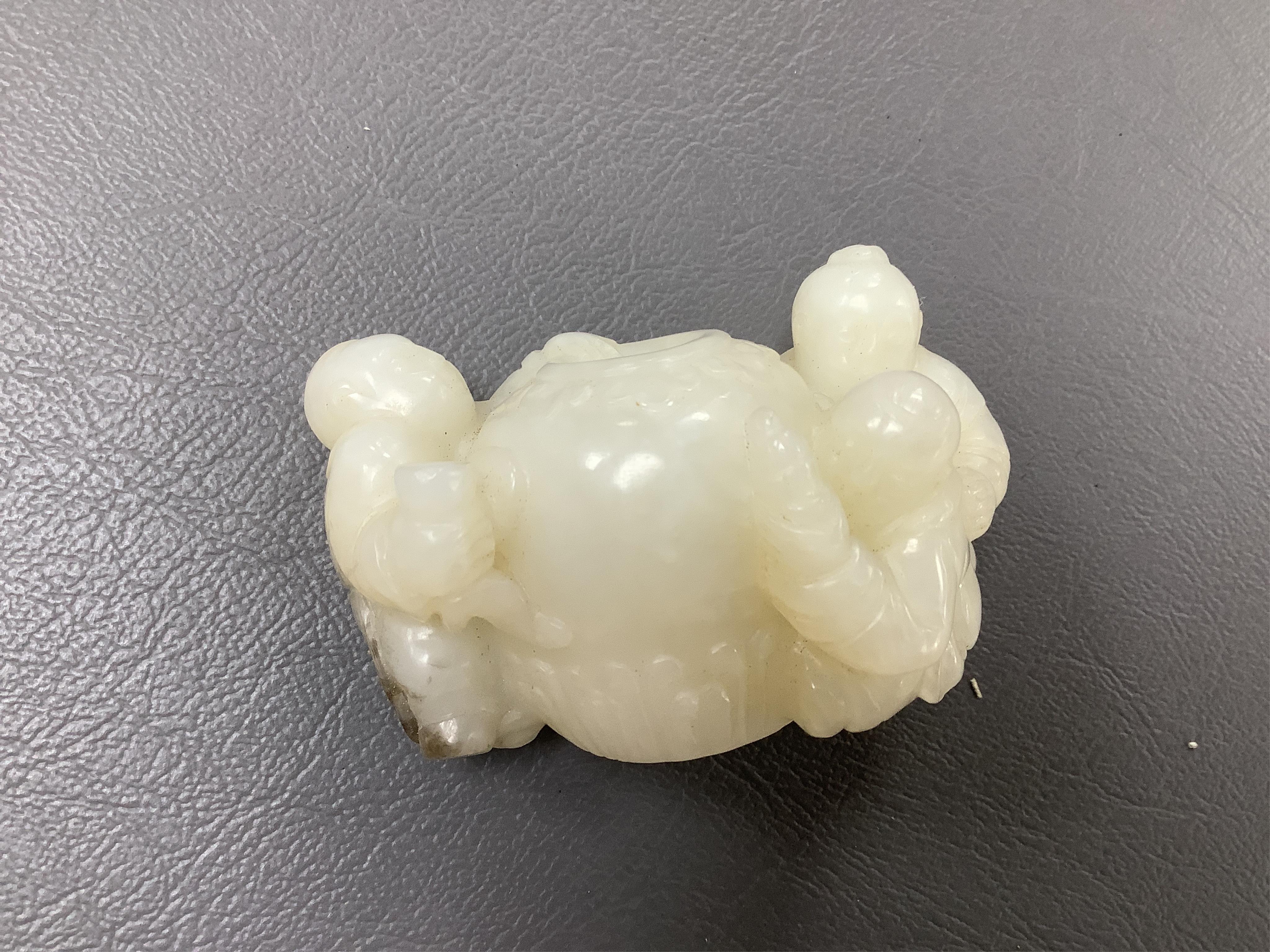 A Chinese white jade 'boys with jar' carving and three shoushan stone figures; luohan, girl with squirrel and mermaid (4), tallest 11cm